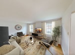This 480-square-foot, one-bedroom, one-bathroom apartment at 600 Broadway in Menands, NY offers a thoughtfully laid-out single-floor living space. Warm hardwood floors flow throughout the living room, hallway, and bedroom, lending the unit a classic, timeless character. The living room is bright and airy, featuring two large windows with views of the surrounding neighborhood and dual cast-iron radiators that provide efficient heating. The 130-square-foot bedroom includes a ceiling fan with light fixture, a closet, and windows overlooking lush greenery, creating a tranquil retreat. The galley-style kitchen is efficiently designed with light wood cabinetry, a full-size refrigerator, a gas range, a sink with dark countertops, and a window that fills the space with natural light. The bathroom is clean and functional, finished with white tile flooring, a pedestal sink, a toilet, and a shower-tub combination beneath a window for ventilation and light. A dedicated entrance and hallway complete the layout, providing a practical transition between rooms. The unit's classic architectural details, including crown molding, panel-style doors, and radiator heating, reflect its traditional character while offering comfortable, well-maintained living in Menands, NY.