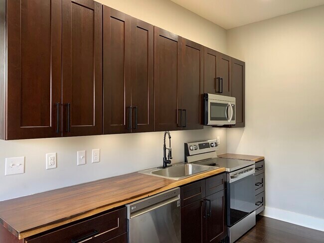 All new Kitchen with 42" cabinets and stainless steel appliances. - 1217 Wheeler St