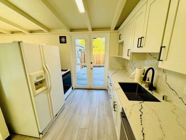 Kitchen and Side Door - 10349 Menhart Ln