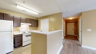 Located at 2925 Baby Ruth Ln in Nashville, TN, this single-story, 2-bedroom, 2-bathroom home offers a well-organized and functional layout. The open-concept kitchen and living area serves as the heart of the home, featuring a peninsula with a white countertop, dark espresso cabinetry, a white electric range, and a full-size refrigerator — all set atop light wood-style flooring that extends throughout the space. Warm, neutral-toned walls complement the clean white trim and doors found in every room.

The bedrooms are bright and comfortable, each equipped with a ceiling fan with light fixture and a window that brings in natural light. The spacious primary bedroom includes generous closet space with wire shelving systems for organized storage. A dedicated laundry room provides added convenience, complete with utility hookups and additional shelving. The two bathrooms feature tub/shower combinations with white surrounds.

A central hallway connects the bedrooms, bathrooms, and living spaces, creating a logical flow throughout the home. Three closets in total offer ample storage. An outdoor patio extends the living space beyond the interior. The consistent flooring, neutral palette, and practical amenities make this Nashville home a well-rounded and move-in ready residence.