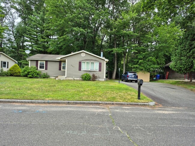 Front of house with spacious yard. Quiet neighborhood to take a walk in or relax after work - 223 Garnet St