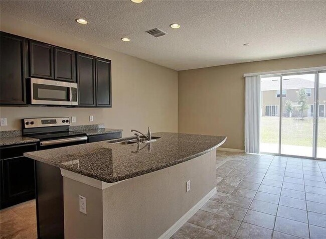 Foto del edificio - 7026 Woodchase Glen Dr