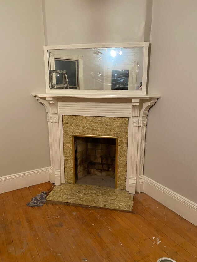 Living Room fireplace, pic was taken before floors were refinished - 150 Church St