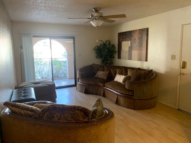 Furnished, ground floor, 2-bedroom condo with assigned covered parking.Pool,Spa,Tennis, Gym. - 5757 W Eugie Ave