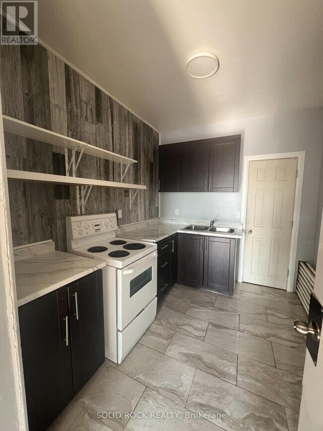 Photo du bâtiment - 89 King St W