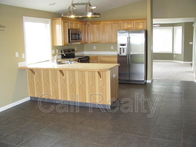 Building Photo - 9302 W Caelen Ave