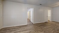This efficiently designed 490 square foot apartment in Killeen, Texas, maximizes space and functionality. The single-story layout comprises one bedroom, one bathroom, a living room, kitchen, and closet. The primary bedroom, measuring 120 square feet, offers ample space for rest and relaxation.

Throughout the apartment, modern wood-look flooring adds warmth and durability. The rooms feature a neutral color palette with white walls, creating a bright and airy atmosphere. Large windows with horizontal blinds allow for abundant natural light and privacy control.

The living area showcases a unique design element with white paneling on the lower half of the walls, adding visual interest and texture. The kitchen, while compact, is well-equipped with white cabinetry, a sink, and essential appliances. A small area rug adds a touch of comfort to the space.

The bathroom, though modest in size, includes a bathtub-shower combination, toilet, and storage shelves for convenience. The bedroom features a ceiling fan for improved air circulation and comfort.

Storage solutions are integrated throughout, including a dedicated closet space. The apartment's layout promotes an open-concept feel, making the space appear larger and more inviting. Located at 2908 Lake Rd, this apartment offers a comfortable living environment in a convenient Killeen location.