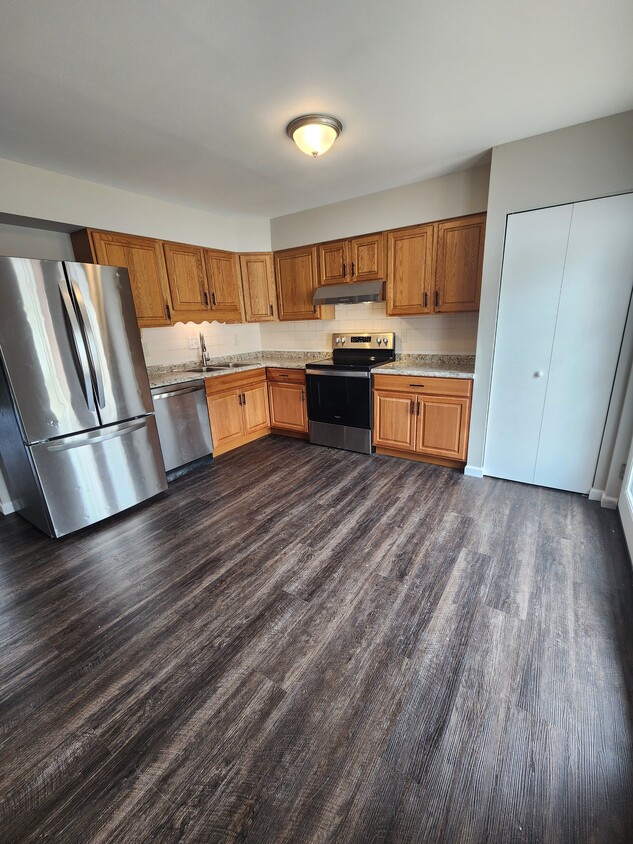 Kitchen with all stainless appliances - 7572 Hazelcrest Dr