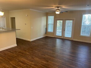 2BR, 2BA Living Room, Dining Room & Kitchen - Seasons at Cane Creek