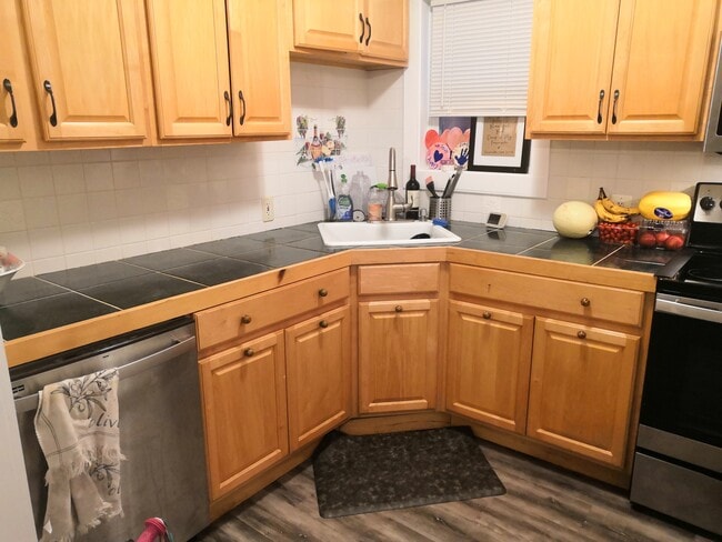 Kitchen. In process of updating hardware, sink and countertops. - 694 Ten Rod Rd