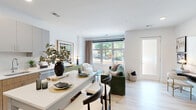 Located at 1031 N Vermont St in Arlington, VA, this thoughtfully designed one-bedroom, one-bathroom residence offers a modern open-concept layout on a single floor. Light wood flooring flows throughout, complementing the bright, white walls and creating a clean, cohesive aesthetic.

The open living and dining area is anchored by a large picture window that frames lush greenery views and fills the space with natural light. A frosted-glass entry door adds privacy while maintaining an airy feel. The well-appointed kitchen features two-tone cabinetry — warm wood lower cabinets paired with soft gray uppers — white quartz countertops, a subway tile backsplash, stainless steel appliances, and a peninsula with bar seating, ideal for casual dining.

The bedroom offers a comfortable retreat with a sizable window overlooking outdoor greenery, light wood flooring, and a dedicated closet. The full bathroom includes light wood vanity cabinetry, a large mirror, tile flooring, and a shower-tub combination. An in-unit laundry area adds everyday convenience. A hallway connects the private spaces efficiently. The overall ambiance is contemporary and welcoming, with a neutral palette and modern finishes throughout.