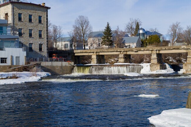 Historic stone mill and bridge on the Mississippi River