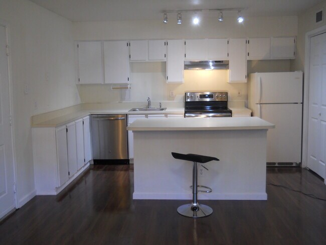 Kitchen and island - 3303 Wyndham Cir