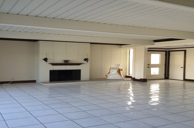 A Living Room Fireplace for those cool coastal evenings can also be viewed from the Dining Room. - 4104 River Ave