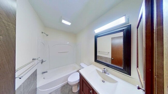 Building Photo - Updated two bedroom duplex, new stainless steel appliances, garage, and hardwood floors
