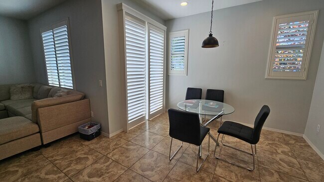 Another view of the dining room, bathed in plenty of light with an adjacent, semi-private patio. - 13123 Park Pl