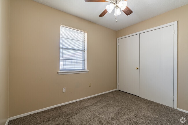 Beige/White 2BR, 1BA - 869SF - Bedroom - The Luxe Apartments