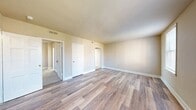 This Presidential Greens apartment offers a well-designed living space in a compact 510 square feet. The layout includes two bedrooms, with the primary bedroom boasting a generous 220 square feet, and one full bathroom. The kitchen is equipped with modern appliances, including a stainless steel electric range and dishwasher, complemented by light wood cabinetry and granite-look countertops.

The living areas showcase a mix of flooring types, with plush carpeting in some rooms and sleek hardwood in others, adding texture and warmth to the space. Large windows in each room flood the apartment with natural light, creating an airy atmosphere. The bathroom features clean white tiles and fixtures, maintaining a bright and hygienic ambiance.

The apartment's efficient design maximizes the use of space, with a closet for storage needs. The neutral color palette of the walls provides a versatile backdrop for personal decor. Overall, this one-floor apartment combines functionality with modern comforts, offering a cozy yet practical living environment in the Presidential Greens complex.