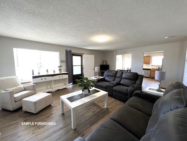 Family room with sample furnishings - 2407 E Conquest St