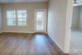 This contemporary 1020 square foot apartment in Kissimmee, FL, offers a harmonious blend of style and functionality. The open-concept design creates a seamless flow between the living room and kitchen, enhancing the sense of space. The kitchen is a highlight, featuring crisp white cabinetry, stainless steel appliances, and a generously sized island, perfect for casual dining or entertaining.

The apartment boasts two bedrooms, including a spacious 240 square foot primary bedroom, and two full bathrooms. Both bathrooms are outfitted with modern fixtures and ample storage. The bedrooms feature plush carpeting, while the main living areas showcase attractive wood-look flooring.

Large windows throughout the apartment flood the space with natural light, creating a bright and airy atmosphere. Ceiling fans in the bedrooms and living area provide additional comfort. The neutral color palette offers a versatile backdrop for various decor styles.

Notable features include a balcony accessible from the living area, providing outdoor space and views. The apartment's layout is efficient, with well-placed doors and hallways maximizing usable space. With its blend of comfort, style, and location, this apartment offers an appealing option for modern living in Kissimmee.