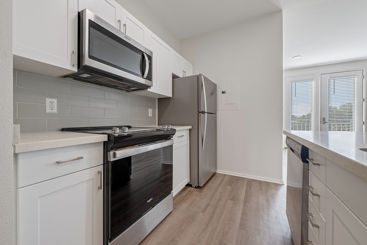 Open concept kitchen and living area - Terraces at Paseo Colorado