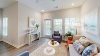 Located at 5001 Willowgate Loop in Fort Myers, FL, this single-story, 2-bedroom, 2-bathroom home offers a well-designed open-concept layout with a bright, coastal aesthetic. Light wood-look flooring flows through the main living areas, complemented by neutral walls and recessed lighting that create a clean, airy atmosphere throughout.

The kitchen serves as the heart of the home, featuring white shaker cabinetry, stainless steel appliances, light stone countertops, and a central island with bar seating — ideal for both cooking and casual dining. The kitchen connects seamlessly to the dining area and a comfortable living room, which is bathed in natural light from large windows with outdoor views.

The primary bedroom offers a serene retreat with plush carpeting and generous closet space, while the second bedroom is equally comfortable, also featuring carpet flooring, a ceiling fan, and a bright window. The home includes four closets in total, providing ample storage throughout.

Both bathrooms are finished with white cabinetry, stone-topped vanities, and wood-look tile flooring. The primary bath features a walk-in glass-enclosed shower with white subway tile, while the second bath includes a shower/tub combo. Additional highlights include a dedicated laundry area, a welcoming entrance, and a private patio perfect for enjoying the Florida outdoors.