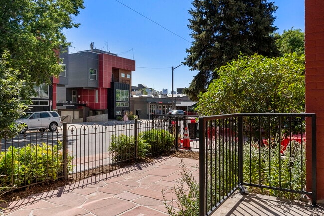 Large, gated fornt patio is perfect for enjoying sunny days or simply people watching. - 3347 Tejon St
