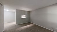 Located at 2730 Lafferty Rd in Pasadena, Texas, this single-floor unit offers a practical and well-organized layout with 2 bedrooms, 3 bathrooms, a living room, and a hallway connecting the main spaces. The living room features neutral gray walls, plush wall-to-wall carpeting, and a window with blinds that allows natural light to filter in, creating a calm and open atmosphere. A pass-through window connects the living area to the kitchen, adding a convenient architectural touch. The spacious primary bedroom is generously sized, finished with soft carpeting, neutral tones, and a window overlooking greenery. It is complemented by a walk-in closet equipped with built-in shelving and hanging rods, offering ample storage. The second bedroom is equally comfortable, with carpeted floors, a textured ceiling, and a window that brings in natural light. All three bathrooms are clean and functional, each featuring a tub-shower combination with tiled surrounds, wood-look vinyl flooring, and modern fixtures. A hallway with overhead ventilation ties the layout together efficiently. The overall design is straightforward and low-maintenance, with a consistent neutral palette throughout that provides a versatile canvas for personalization.