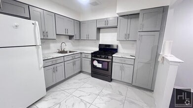 Building Photo - GUT RENOVATED VERY LARGE 3 BEDEROOMS W/ PR...