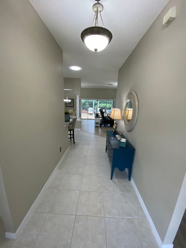 Building Photo - Gorgeous 3 + 2 Turnkey ANNUAL Lease w/Swim Spa & Large Private Screened in Patio In The Village o...