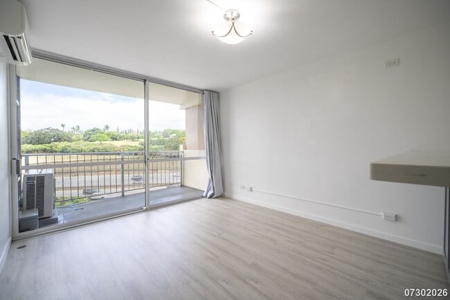 Building Photo - Renovated 1-Bedroom at The Highlander — Split AC, In-Unit Laundry, Pool & Gym Access