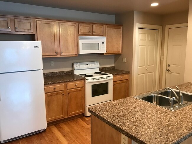Kitchen appliance include refrigerator, range, microwave, and dishwasher. - 107 Scenic Drive