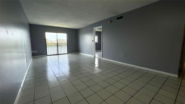 Building Photo - 9917 W Okeechobee Rd