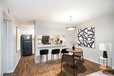 This 850 square foot apartment in Nashville, TN offers a practical and modern living space. The single-floor layout comprises three bedrooms, including a spacious 190 square foot primary bedroom, one bathroom, and an open-concept kitchen and living area. The kitchen stands out with its updated design, featuring white cabinetry, granite countertops, and stainless steel appliances. The galley-style layout maximizes efficiency while providing ample counter space.

Throughout the apartment, a mix of flooring types adds character. The kitchen and living areas boast attractive hardwood floors, while the bedrooms are carpeted for comfort. Ceiling fans in multiple rooms offer improved air circulation and ambient lighting. Large windows in the bedrooms and living area allow for natural light, enhancing the sense of space.

The bathroom, while not expansive, appears clean and functional with a standard tub-shower combination. Storage solutions include built-in closets in the bedrooms and additional shelving in the hallway. The neutral color palette throughout provides a blank canvas for personal decorating styles.

Despite its compact size, the apartment's layout feels open and uncluttered. The efficient use of space makes this 3-bedroom unit an attractive option for small families or those seeking extra rooms for home offices or guests. Located in the Pebble Creek Circle area of Nashville, this apartment combines practicality with modern amenities in a desirable location.