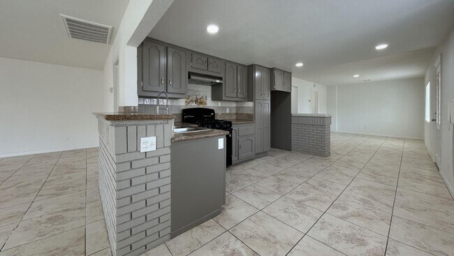 Building Photo - PRICE REDUCTION! Spanish Style 3 Bedroom 2...
