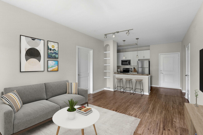 Experience modern elegance in this beautifully designed open-concept living space. - Addison at South Tryon