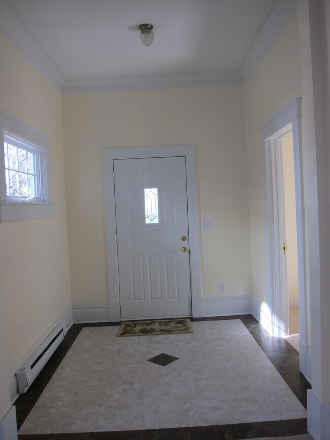 Front entry from inside. Tile floor is two-tone and matches the other tiling in the house. - 1435 South Center Street
