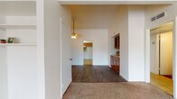 Located at 3624 NW 42nd St in Oklahoma City, Oklahoma, this single-floor home offers a straightforward and functional layout with notable architectural details throughout. The living area is highlighted by soaring vaulted ceilings and a ceiling fan, creating an open and airy atmosphere. A mix of wood-look flooring and neutral carpet flows through the common areas and bedrooms, providing warmth and easy maintenance. A built-in cabinet with a countertop serves as a convenient transitional element between the living and kitchen areas. The kitchen is equipped with warm-toned wood cabinetry, light countertops, a double-basin stainless steel sink, and tile flooring, offering ample storage and workspace. The bedrooms are carpeted for comfort, with one featuring vaulted ceilings and a spacious walk-in closet with built-in shelving. Windows dressed with vertical blinds allow natural light to filter into the bedrooms. The bathroom includes a full tub-shower combination with tiled surround and wood-look flooring. The living room benefits from a sliding glass door that invites natural light and provides outdoor access. Overall, the home presents a clean, functional design well-suited for everyday living.