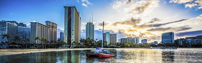 Boats are a common sight of the beaches of Honolulu.