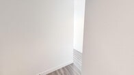 Located on the 17th floor in the heart of Calgary's downtown SE, this modern 2-bedroom, 2-bathroom residence offers an impressive blend of contemporary design and sweeping urban views. Light hardwood-style flooring flows throughout the open-concept layout, complemented by crisp white walls and recessed lighting that create a bright, airy ambiance.

The kitchen is a standout feature, showcasing a large waterfall-edge island with an undermount sink, sleek white flat-panel cabinetry extending to the ceiling, a gas cooktop, built-in oven, and stainless steel refrigerator. Floor-to-ceiling windows in the living area frame breathtaking panoramic views of the Calgary skyline, including iconic landmarks such as the Calgary Tower.

The primary bedroom is generously proportioned, with expansive windows offering sweeping city and neighbourhood views. The ensuite bathroom features a clean, all-white design with a wide vanity, undermount sink, large mirror, and a glass-enclosed marble-tiled shower. The second bathroom is equally well-appointed, with a soaker tub and shower combination, tiled flooring, and modern fixtures. A dedicated closet provides additional storage. The second bedroom also benefits from large corner windows with broad city views, filling the space with abundant natural light.