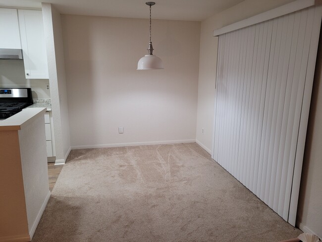 Dining Area - light fixture, paint, windows blinds and carpet - 2 yrs 4 mths old - 13006 Wimberly Sq