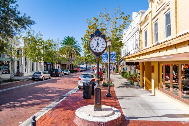 The iconic downtown Eustis clock sits on the main street filled with shops and restaurants.