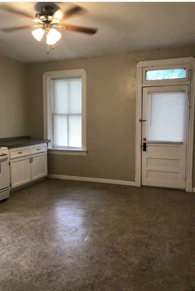 Large eat in kitchen. Previous resident fit a table with 6 chairs. Paint is updated to white. - 5313 Magnolia Ave