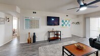 Located at 2635 College Knight Court in Orlando, FL, this four-bedroom, two-bathroom residence offers a well-designed single-floor layout ideal for shared living. The open-concept great room seamlessly integrates the living, dining, and kitchen areas under recessed lighting and a ceiling fan, creating a bright and cohesive social space. Wood-look flooring runs throughout the main living area, adding a clean, contemporary feel.

The kitchen is outfitted with white cabinetry, dark countertops, black appliances including a refrigerator, range, microwave, and dishwasher, plus a peninsula that doubles as a breakfast bar. A dedicated dining area sits adjacent, comfortably accommodating a full table and chairs.

The living room opens through sliding glass doors to a private balcony overlooking landscaped greenery — a peaceful outdoor retreat. Each of the four bedrooms features plush carpeting, a ceiling fan, natural light from large windows, and a dedicated closet. The bedrooms offer a comfortable, functional layout suited for studying and rest.

Two full bathrooms serve the residence, each featuring a shower-tub combination. Additional spaces include a laundry room, pantry, utility room, and a hallway connecting all areas efficiently. The layout balances communal and private spaces throughout.