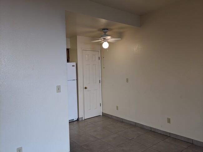 Ceiling fan/light over dining area. - 5750 N Camino Esplendora