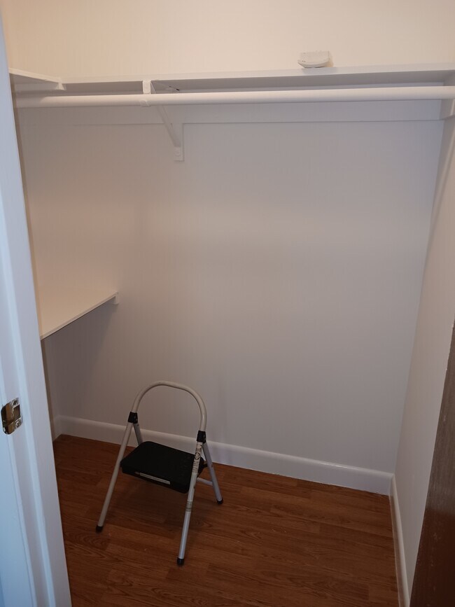 Walk in closet off living room offers extra storage space - 27 North St