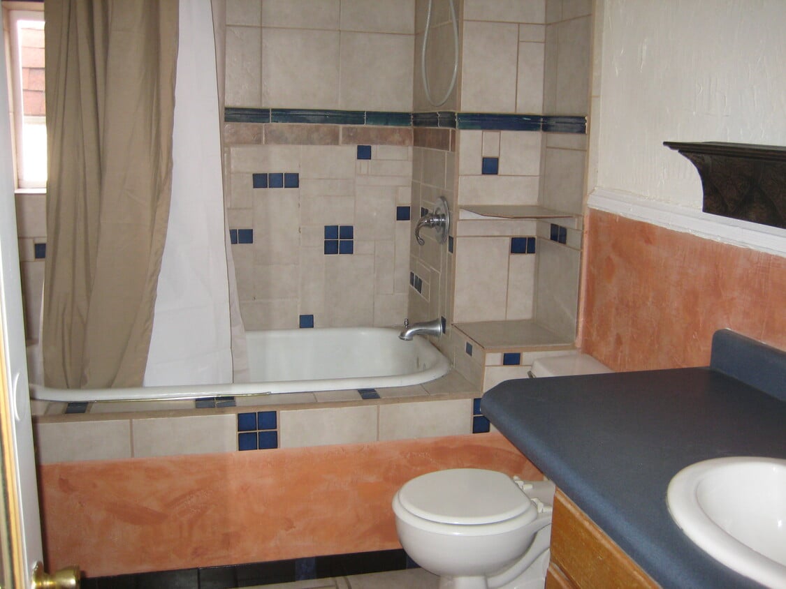 Fun, colorful mosaic bathroom with clawfoot bathtub. - 219 Midway Ave. UPSTAIRS