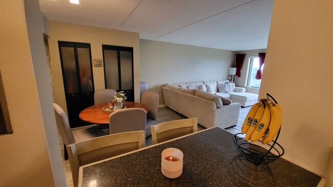 View of dining and living room from breakfast bar - 6300 Stevenson Ave