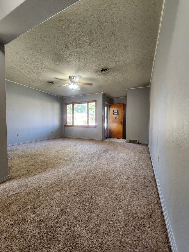 Entry door and living room - 813 East Ave S