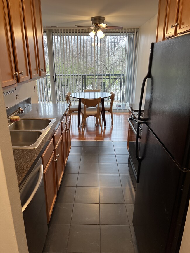 Galley kitchen into dining area - 5950 Oakwood Dr